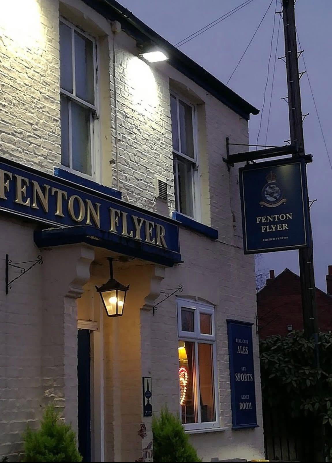 The pub entrance in the evening